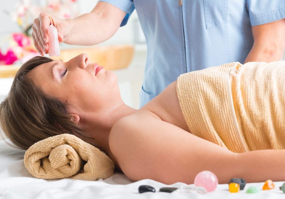 Close-up of young woman having reflexology