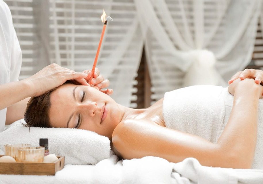 Close-up of young woman having reflexology