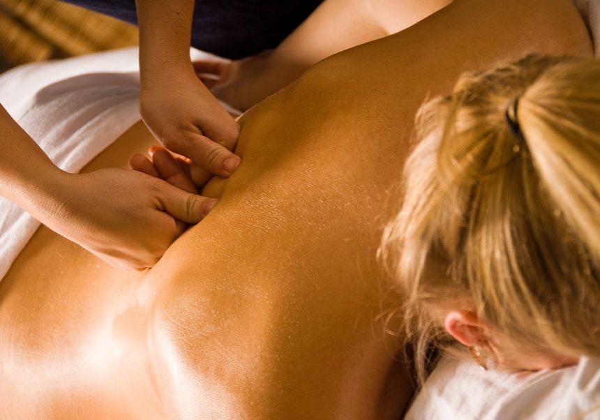 woman at a day spa getting a deep tissue massage