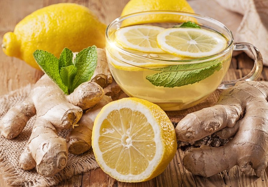 Ginger tea with lemon on a wooden table