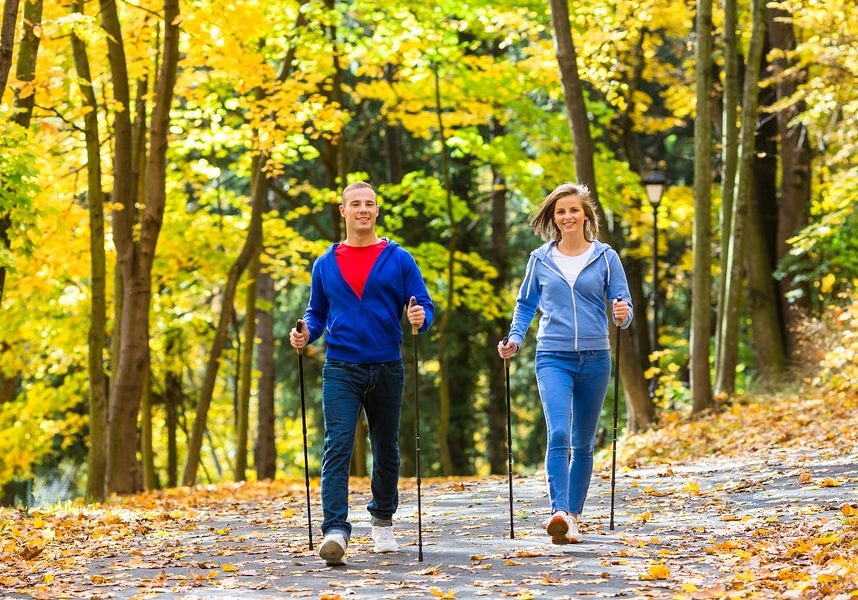 Nordic walking - active people working out outdoor