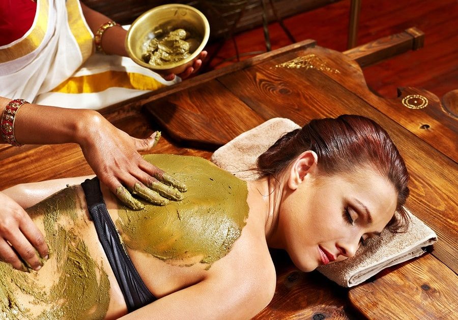 Young woman having body Ayurveda spa massage.
