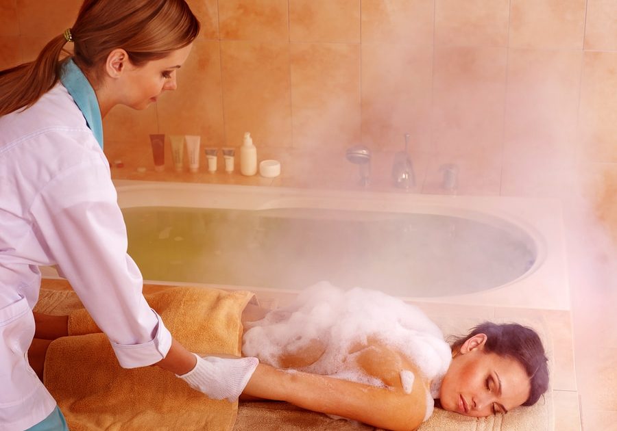 Young woman in hammam or turkish bath.