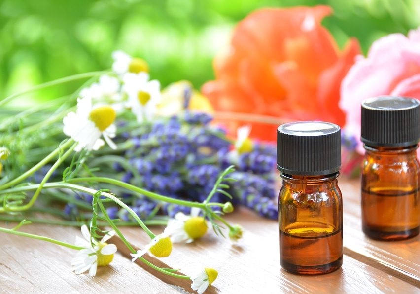 aromatherapy oils with herbal flowers rose,chamomile,and lavender