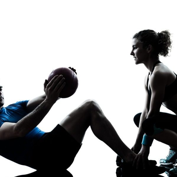 img one caucasian couple man woman personal trainer coach exercising weights fitness ball silhouette studio isolated on white background